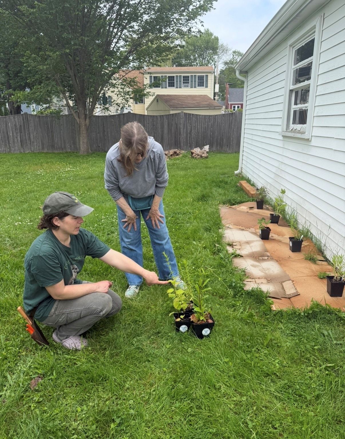 Resilient Yards coach sharing knowledge with participant about native plants